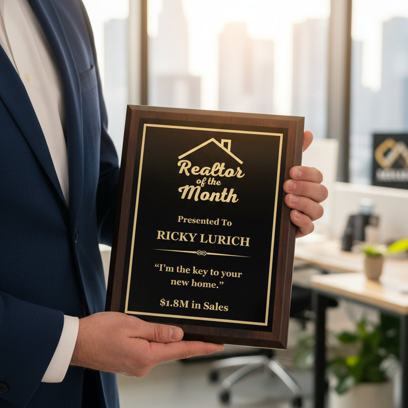 Man in business attire holding customizable walnut plaque with personalized "Realtor of the Month" engraving